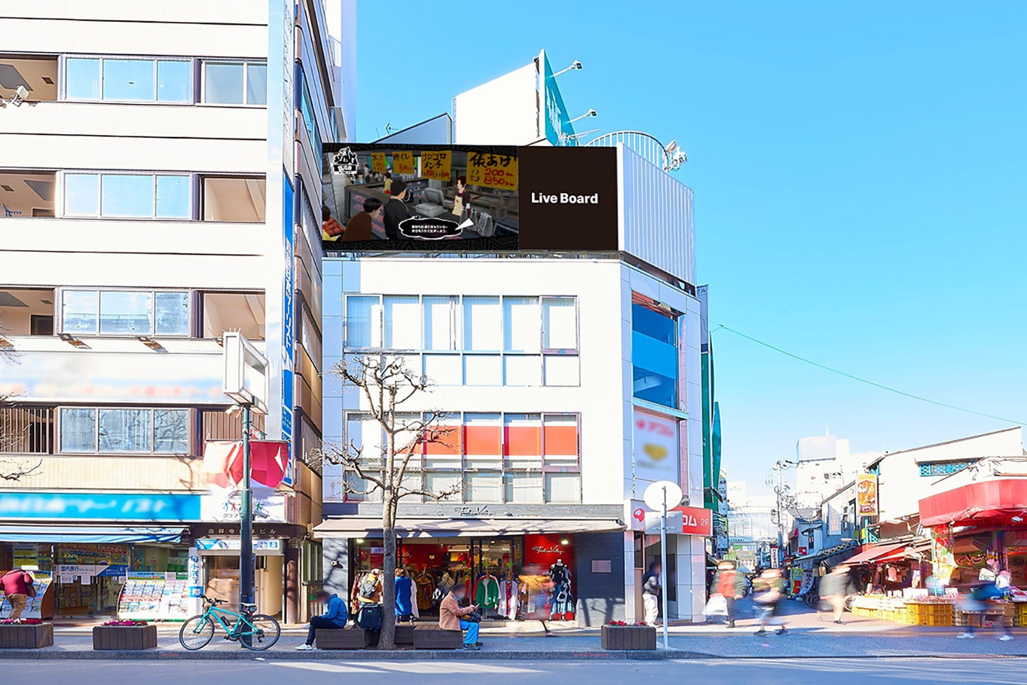 記事画像2: 屋外のビルに設置された「Live Board」と書かれたデジタルサイネージ