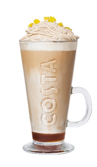 コスタのロゴ入りグラスに入った、ホイップクリームとレモンピールが乗ったラテ