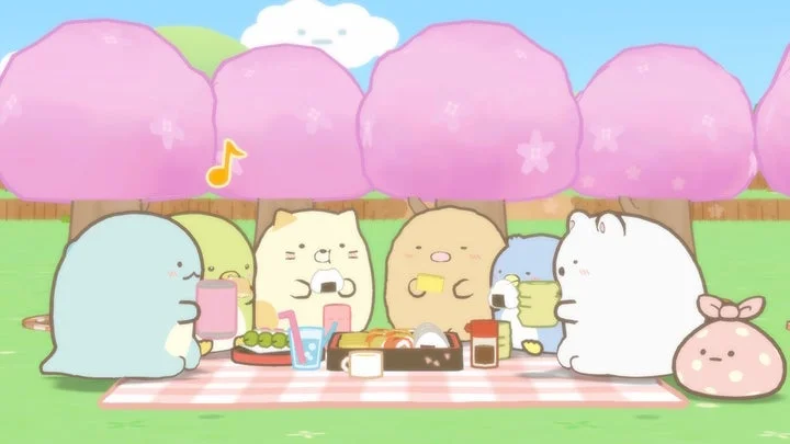 桜の下ですみっコたちが楽しくピクニックをする様子