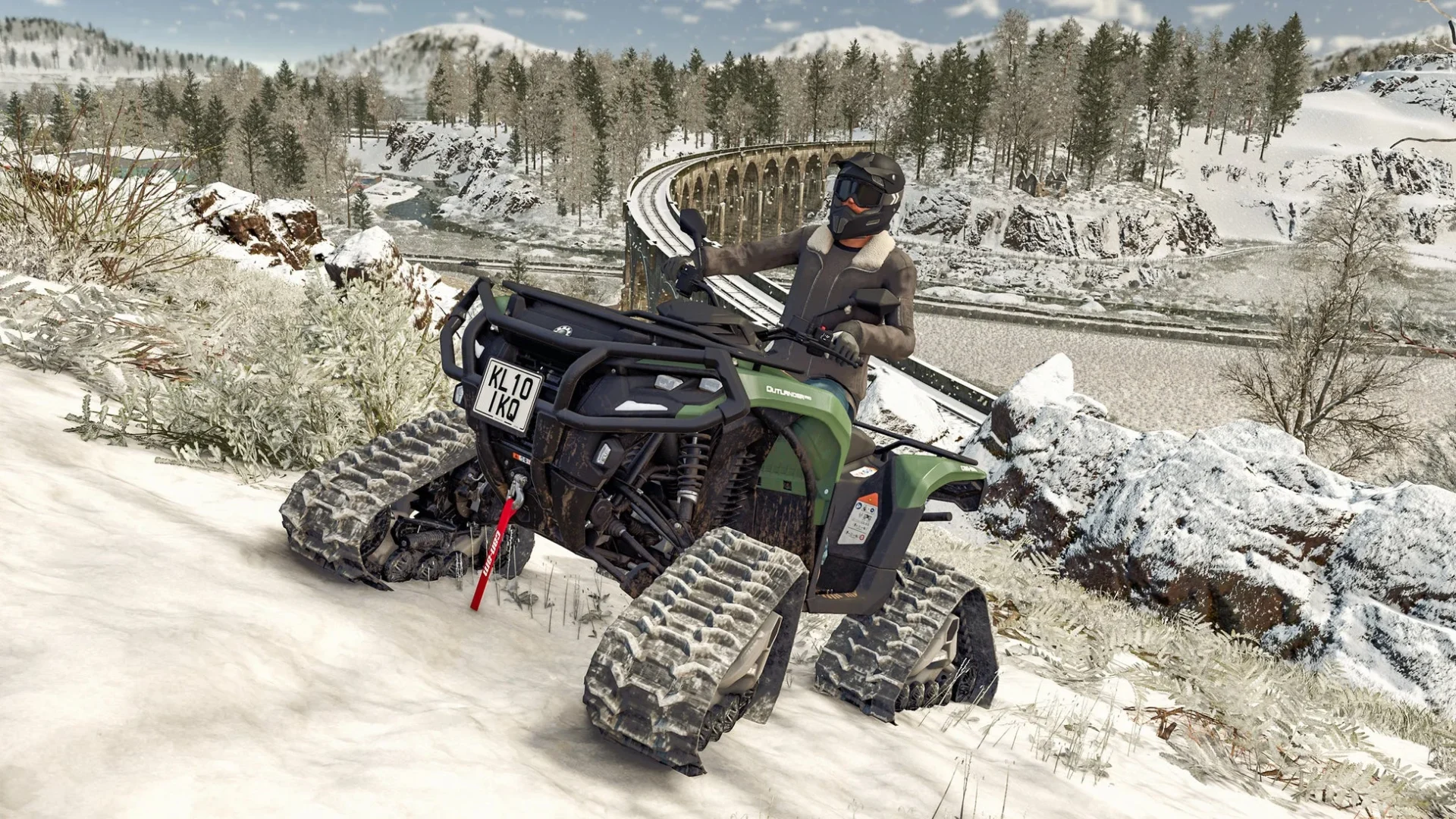 雪道を走行するクローラー付きATV