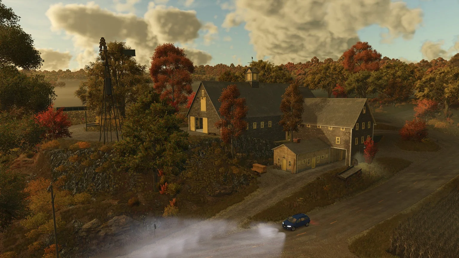 秋の紅葉が美しい丘の上の農場風景