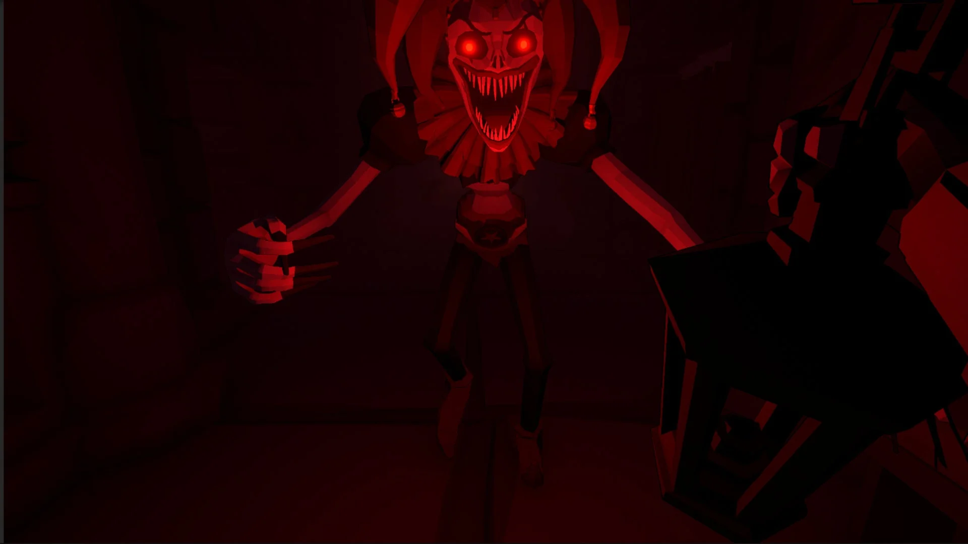 暗闇から現れ、赤い目でプレイヤーを見つめるジェスターのゲーム画面