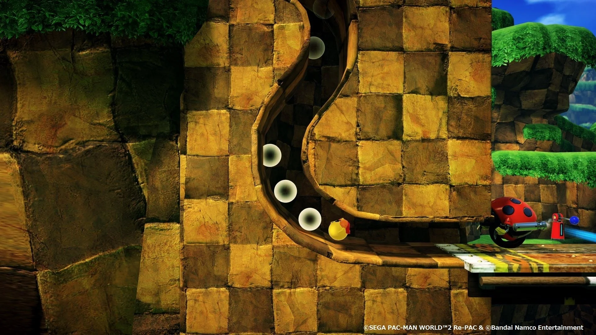 パックマンがリングを集めて高速で駆け抜けるゲーム画面