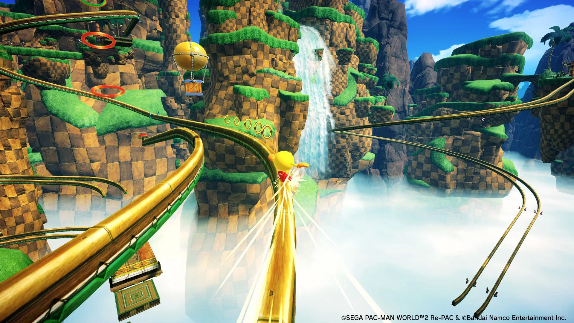 パックマンがグラインドレールからジャンプするゲーム画面