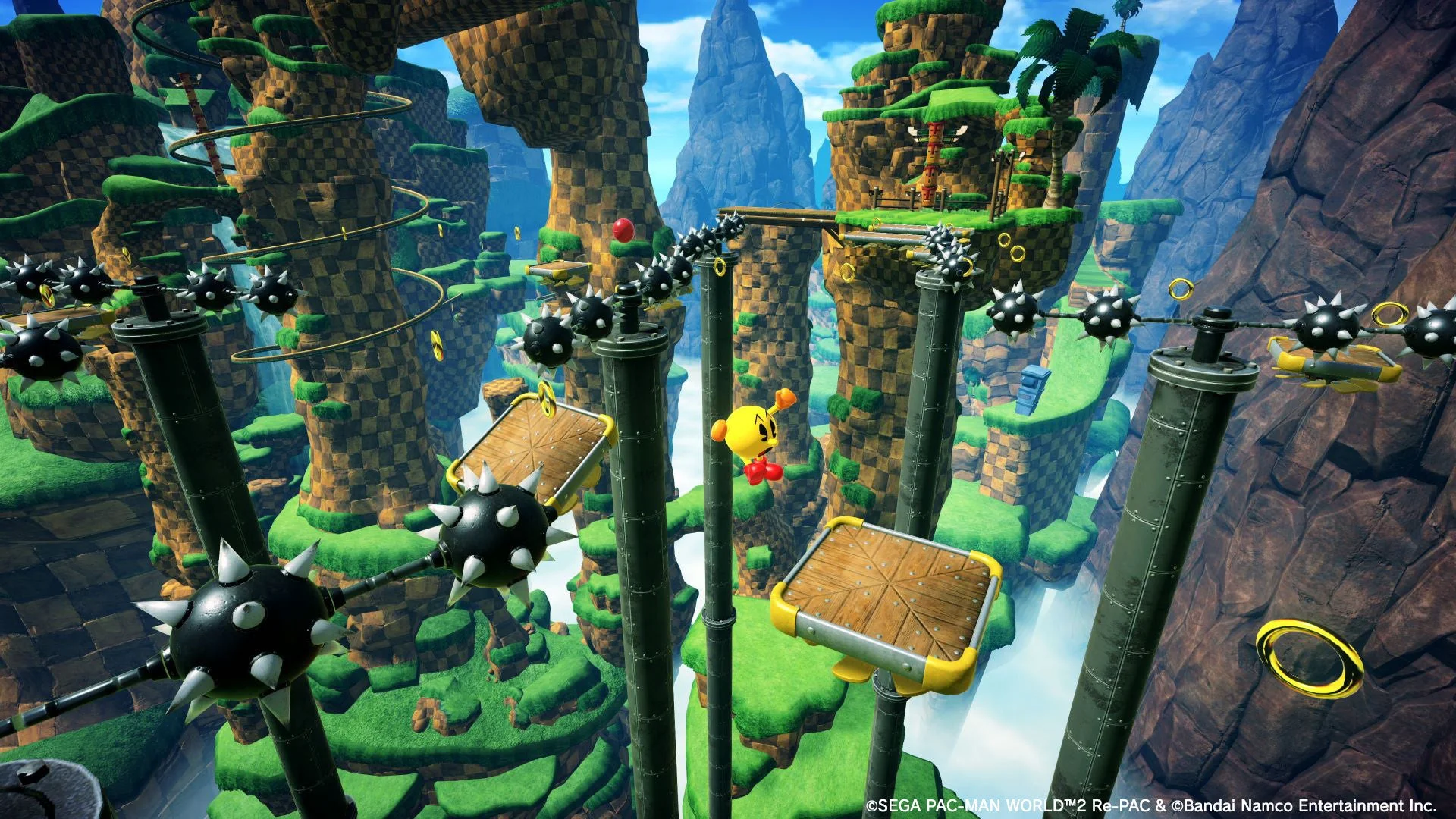 グラインドレールで敵を避けて進むパックマンのゲーム画面