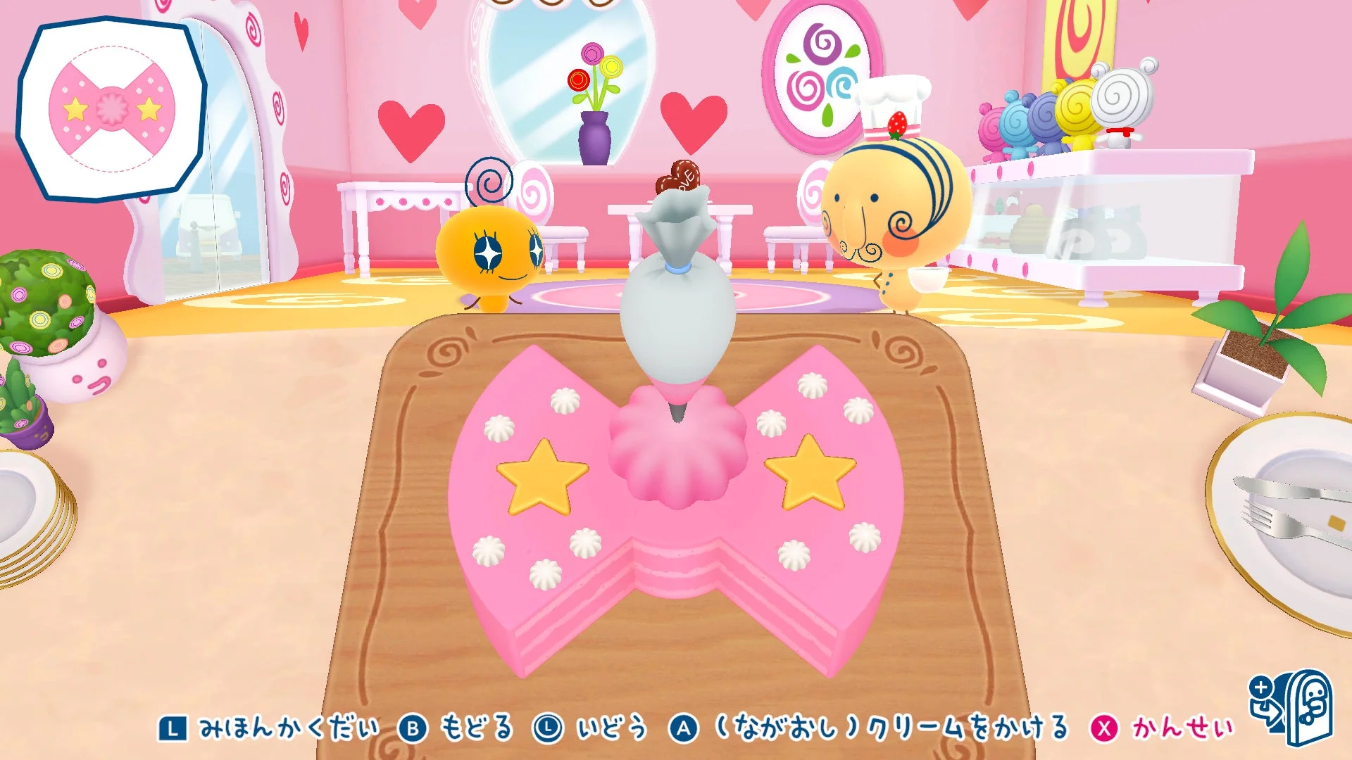 ケーキやさんのゲーム画面でリボン形ケーキをデコレーション