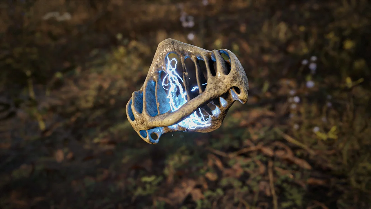 青い光を放つ骨のような形のアーティファクト