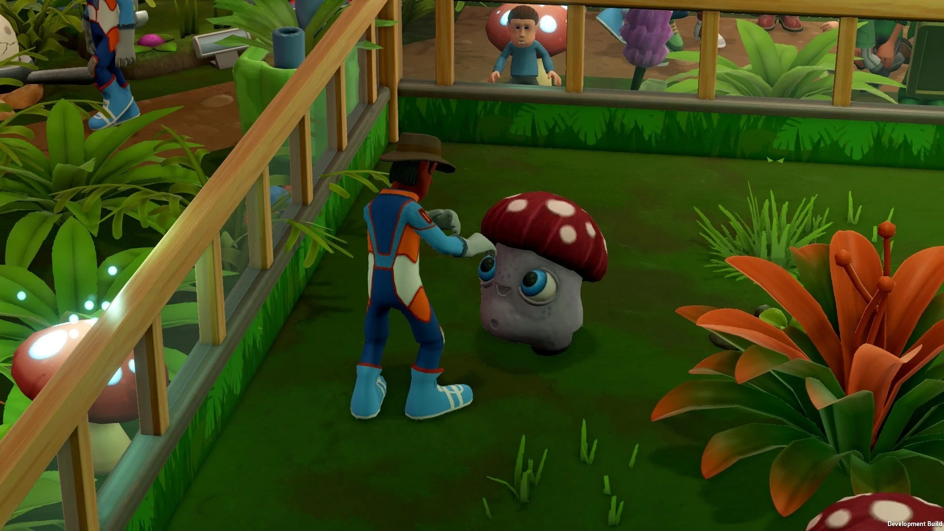 宇宙テーマのスタッフ衣装を着たキャラクターとキノコのような展示品