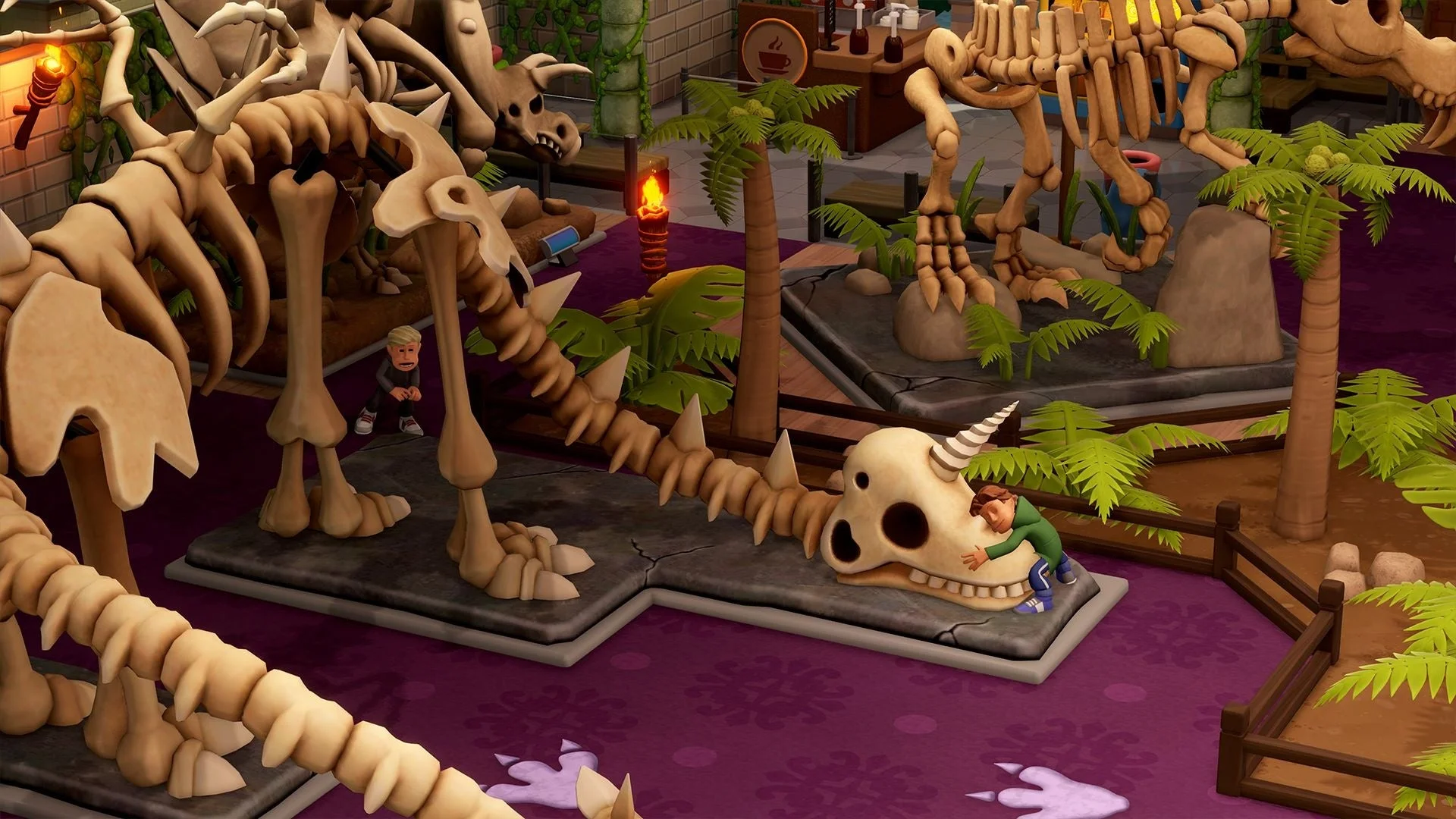 博物館に展示された恐竜の骨格標本と来場者