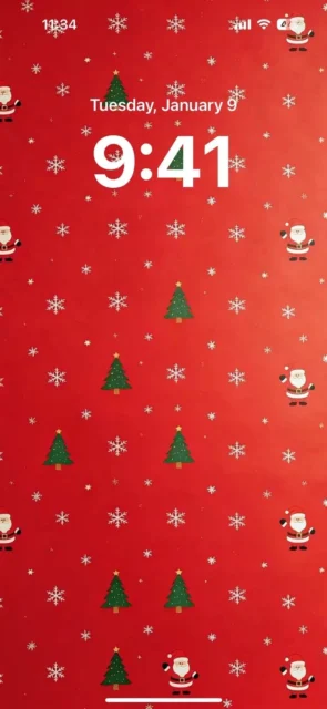 クリスマス柄の紙を模したスマホ壁紙