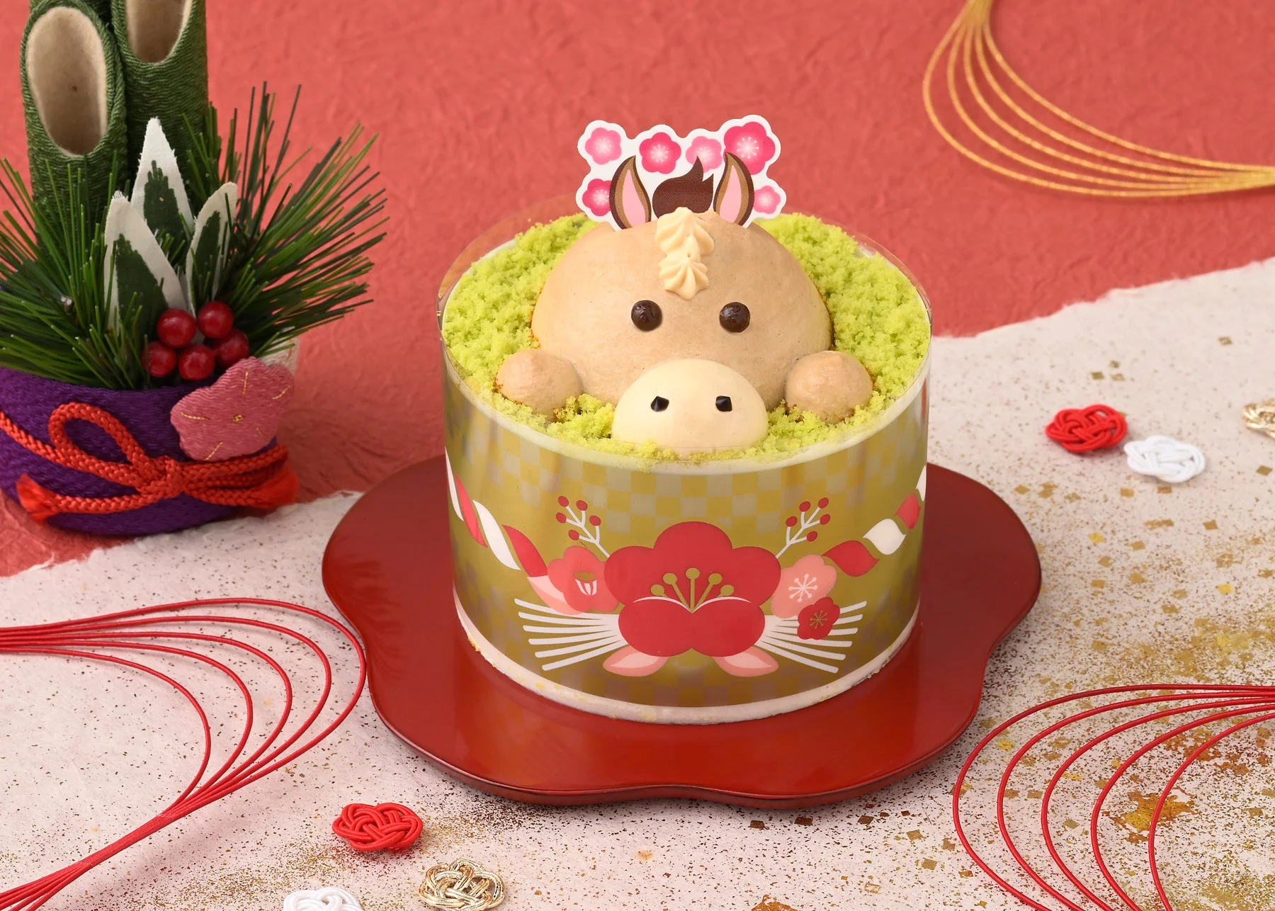 抹茶スポンジクラムとキャラメルクリームで草原を駆ける午を表現したケーキ