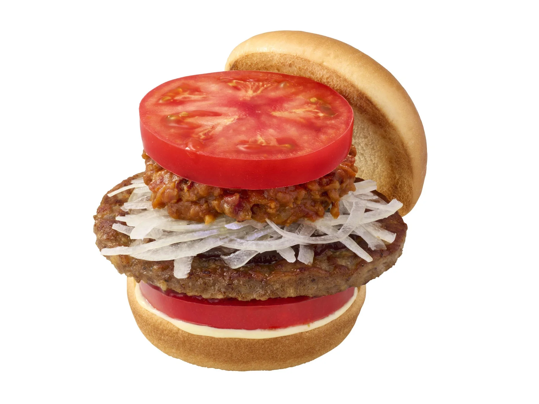 新とびきり 大盛りトマト チリバーガーのクローズアップ写真。