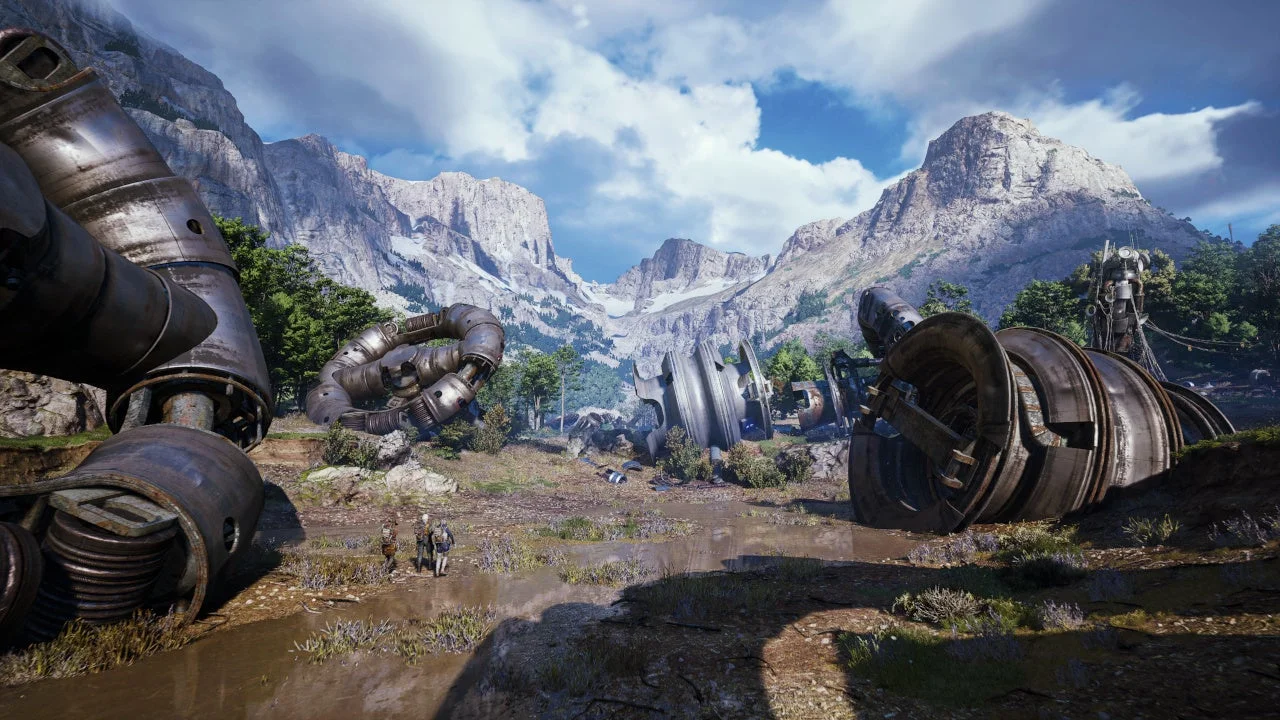 荒廃した世界観を示す山岳地帯と巨大な機械の残骸