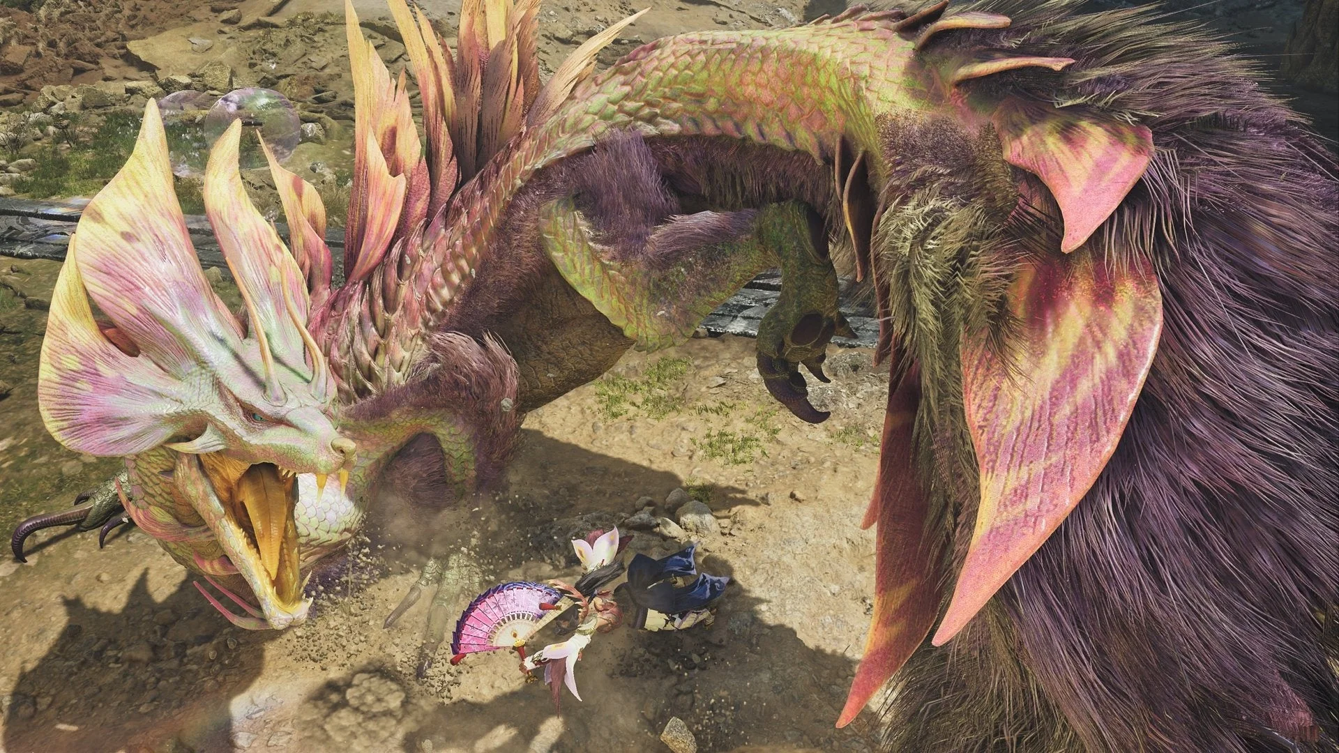 『モンスターハンターワイルズ』のゲーム画面、ハンターが大型モンスター「タマミツネ」と戦闘中