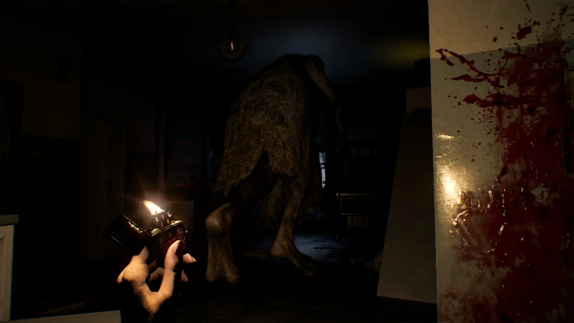 ライターの光に照らされる異形の怪物