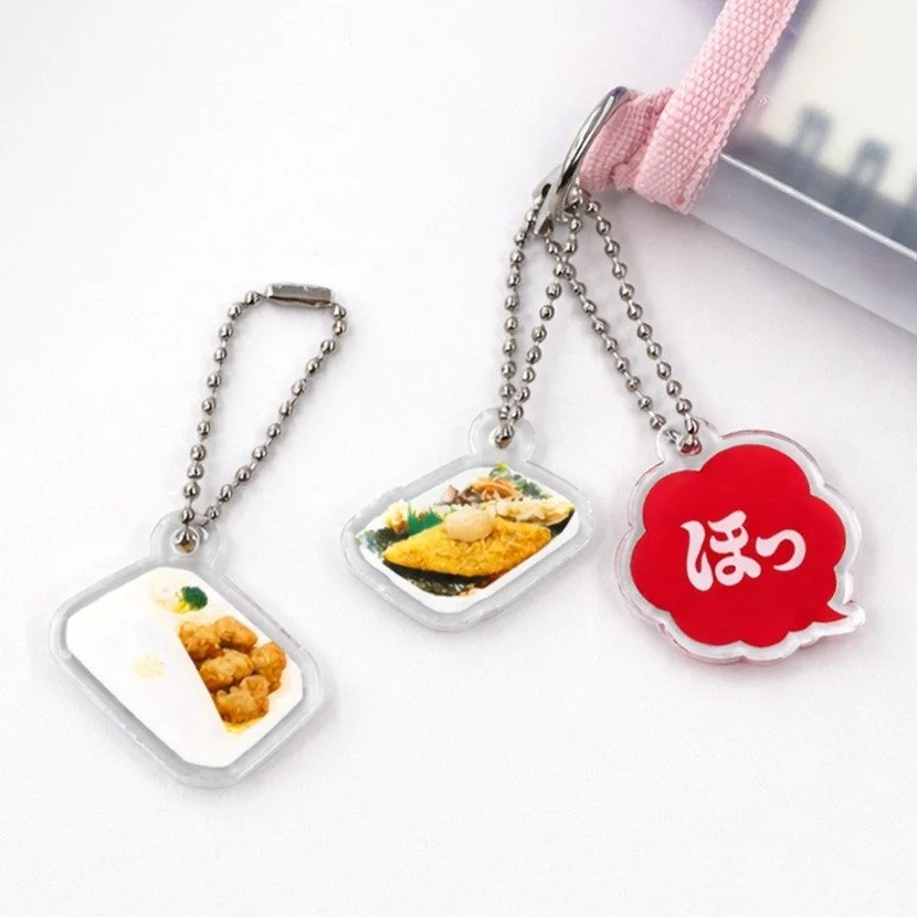 唐揚弁当、のり弁当、ほっのロゴを模した3種類のアクリルキーホルダー