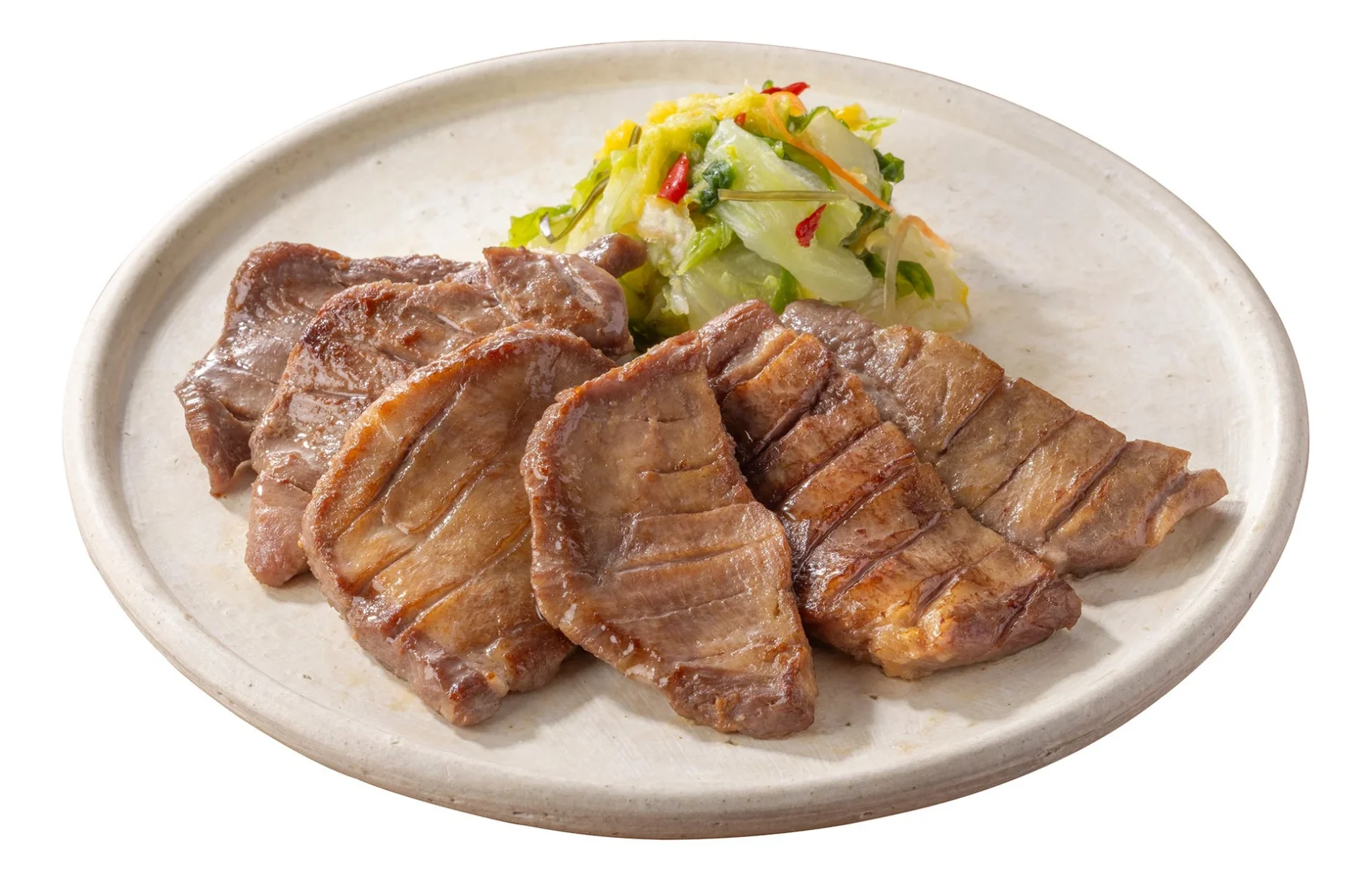 吉野家 冷凍牛たんのアップ。厚切りで焼き目がついた牛たん。