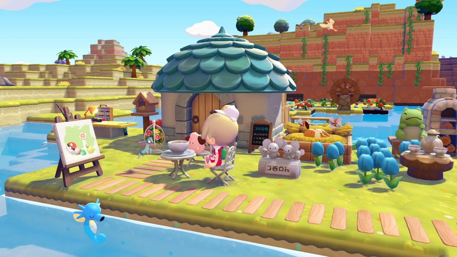 「ぽこ あ ポケモン」ゲーム画面：水辺の家と庭でくつろぐ様子