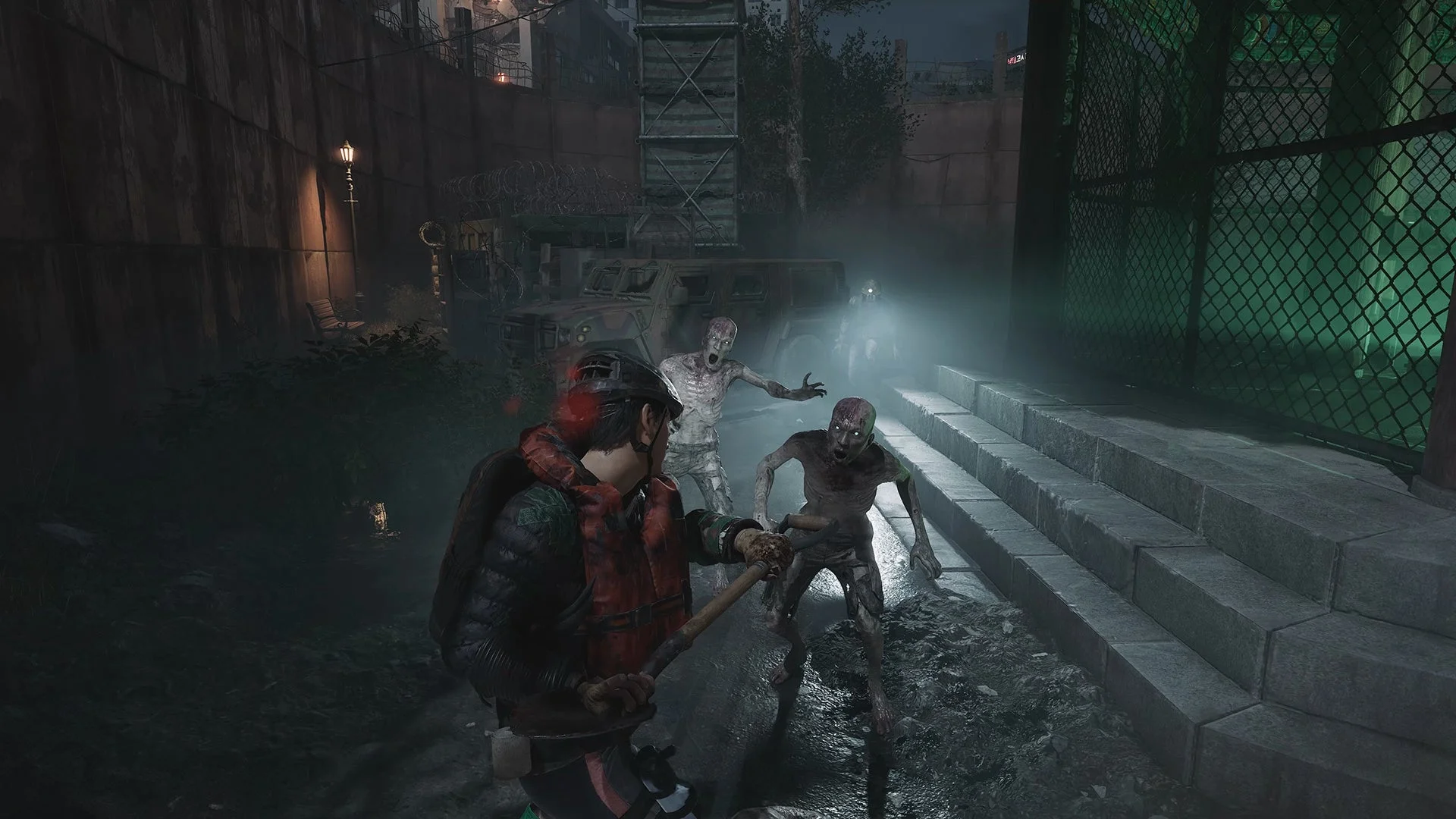 暗闇の中でゾンビと近接戦闘を行うプレイヤーのゲーム画面