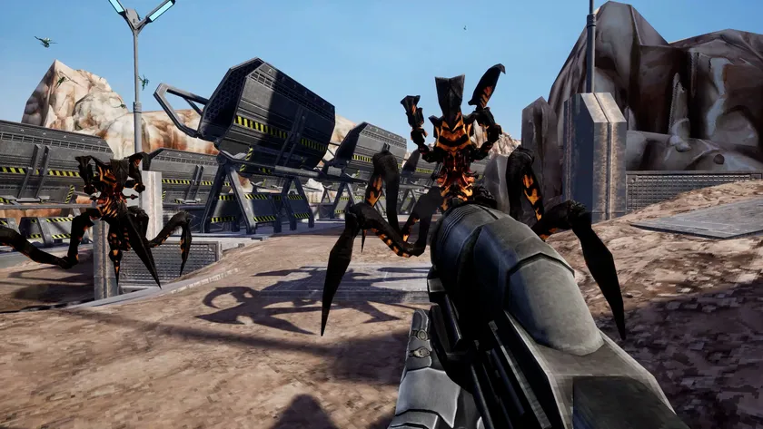 プレイヤーに迫るアラクニドの群れを銃で迎え撃つ様子