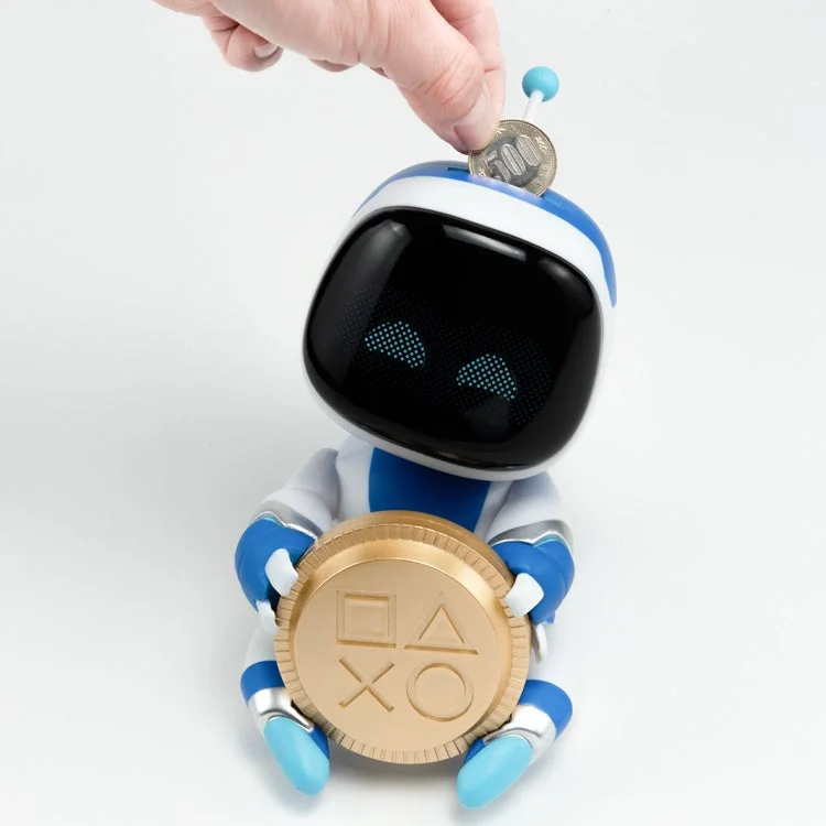 ASTRO BOT Coin Buddies貯金箱にコインを投入する様子